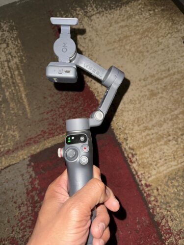 DJI Osmo Mobile 7P Gimbal Stabilizer for iPhone. Android. Native Tracking. Lighting. 3-Axis Phone Gimbal. Quick Launch. One-Tap Edit. Built-in Extension Rod & Tripod. 10hrs Use. Phone Charging photo review